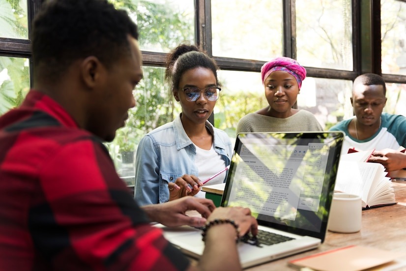 A diverse team of creatives collaborating in a modern workspace